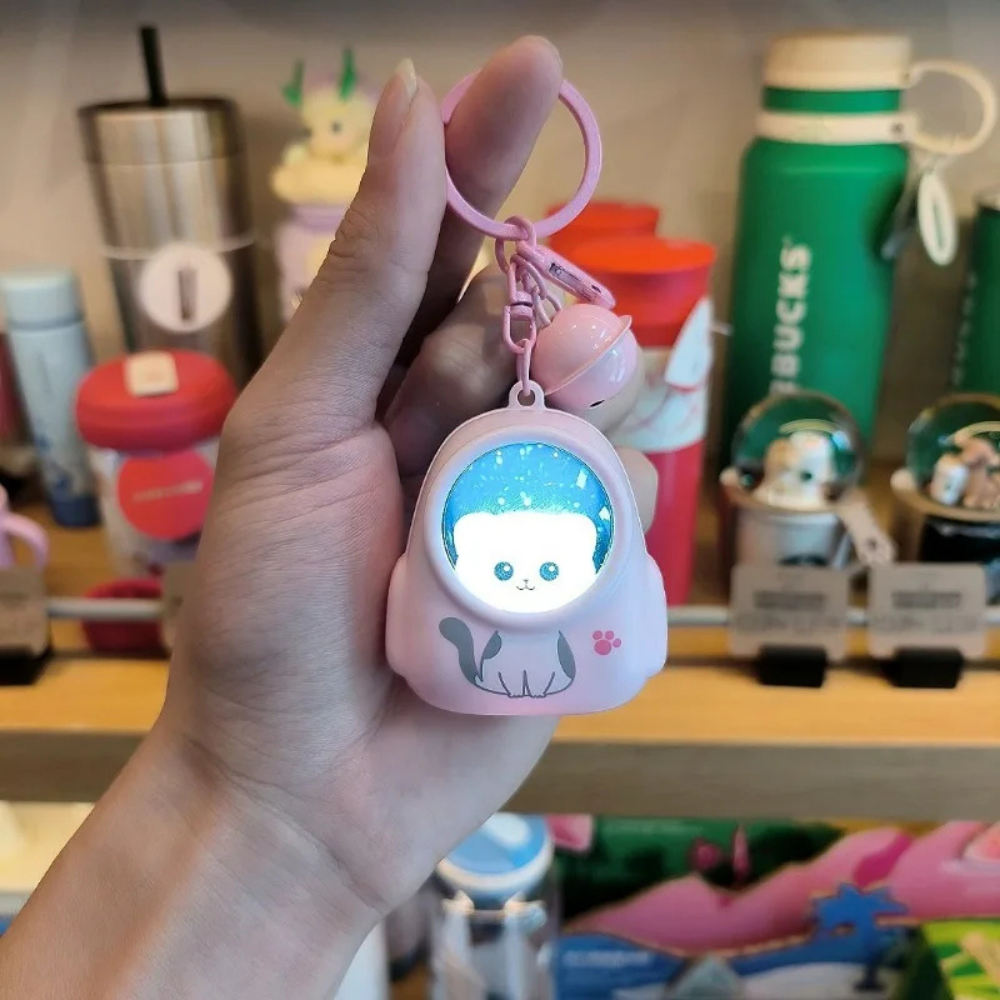 AstronautKeychain 1+1 GRATIS: Gloeiend Schattige Astronaut Dier Sleutelhanger